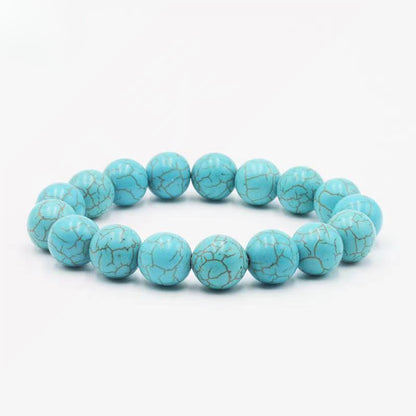 Natural turquoise healing bracelet worn during meditation to calm anxiety and enhance spiritual awareness